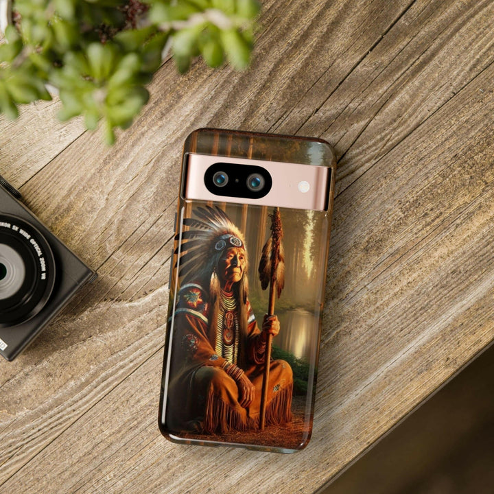 Phone case featuring a serene Native American elder holding a staff by a tranquil river. Detailed art for heritage appreciation.