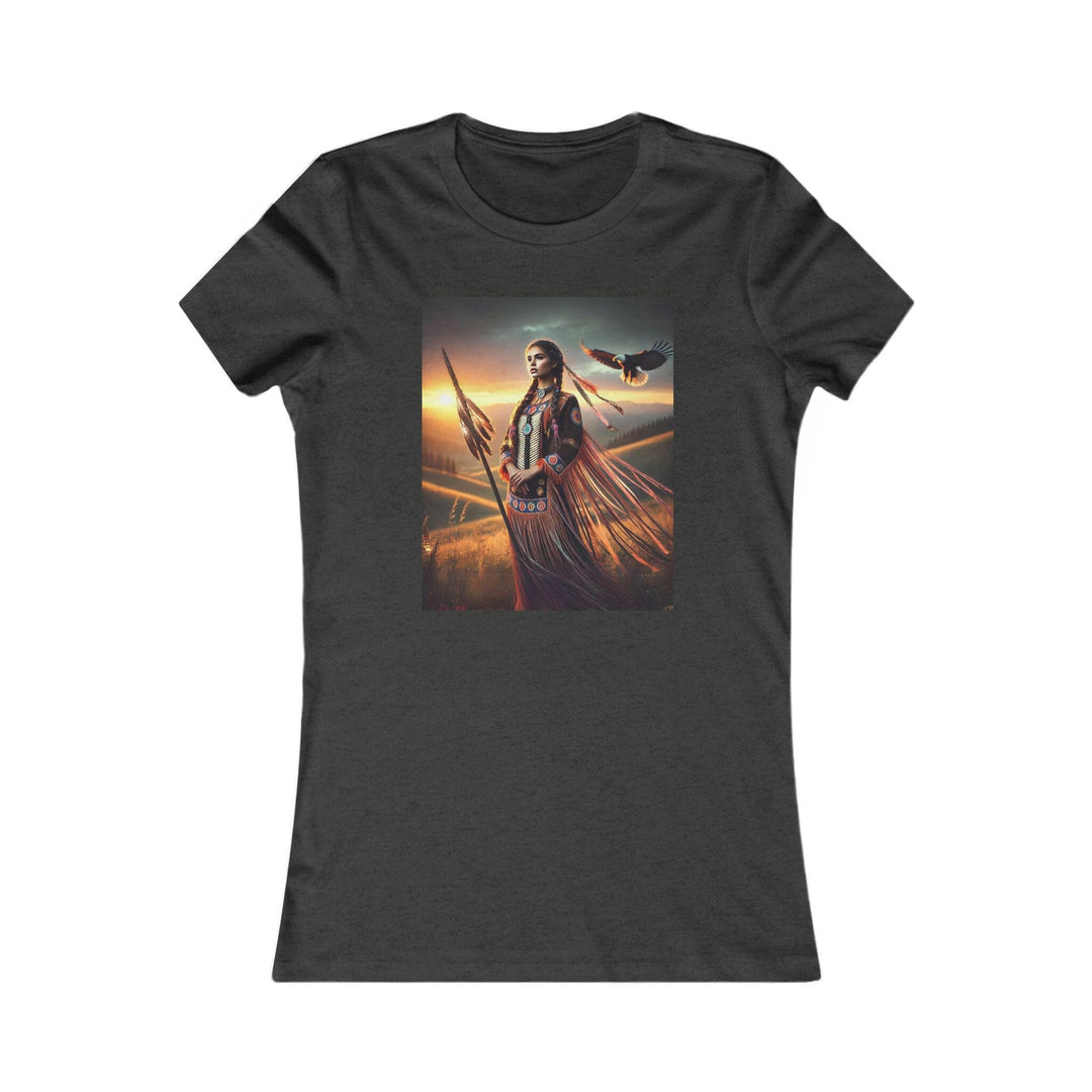 Dark Heather Grey T-shirt featuring an illustration of a Native American warrior woman with a spear, set against a dramatic sunset. Represents strength, heritage, and cultural pride.