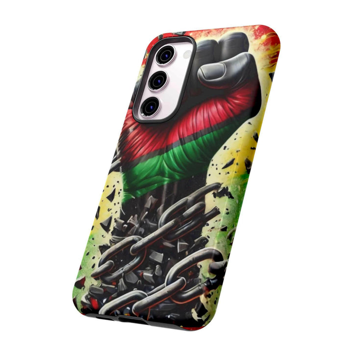 Black Pan-African fist phone case with chains breaking free, symbolizing strength and liberation. Durable and stylish for cultural expression.