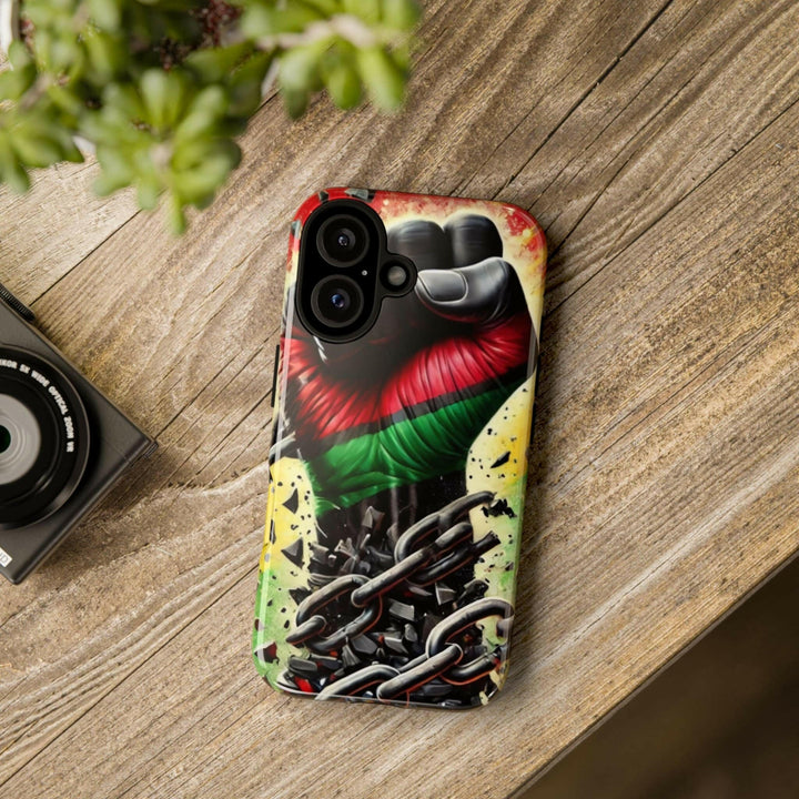 Black Pan-African fist phone case with chains breaking free, symbolizing strength and liberation. Durable and stylish for cultural expression.