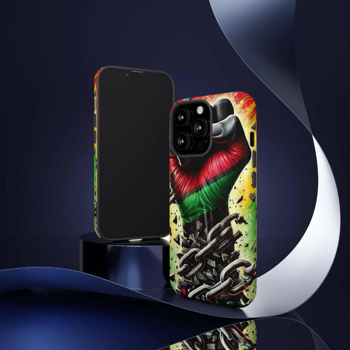 Black Pan-African fist phone case with chains breaking free, symbolizing strength and liberation. Durable and stylish for cultural expression.