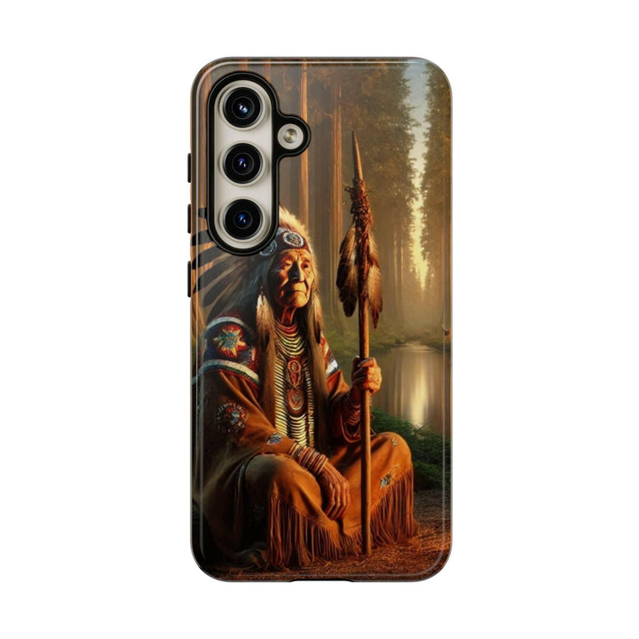 Phone case featuring a serene Native American elder holding a staff by a tranquil river. Detailed art for heritage appreciation.