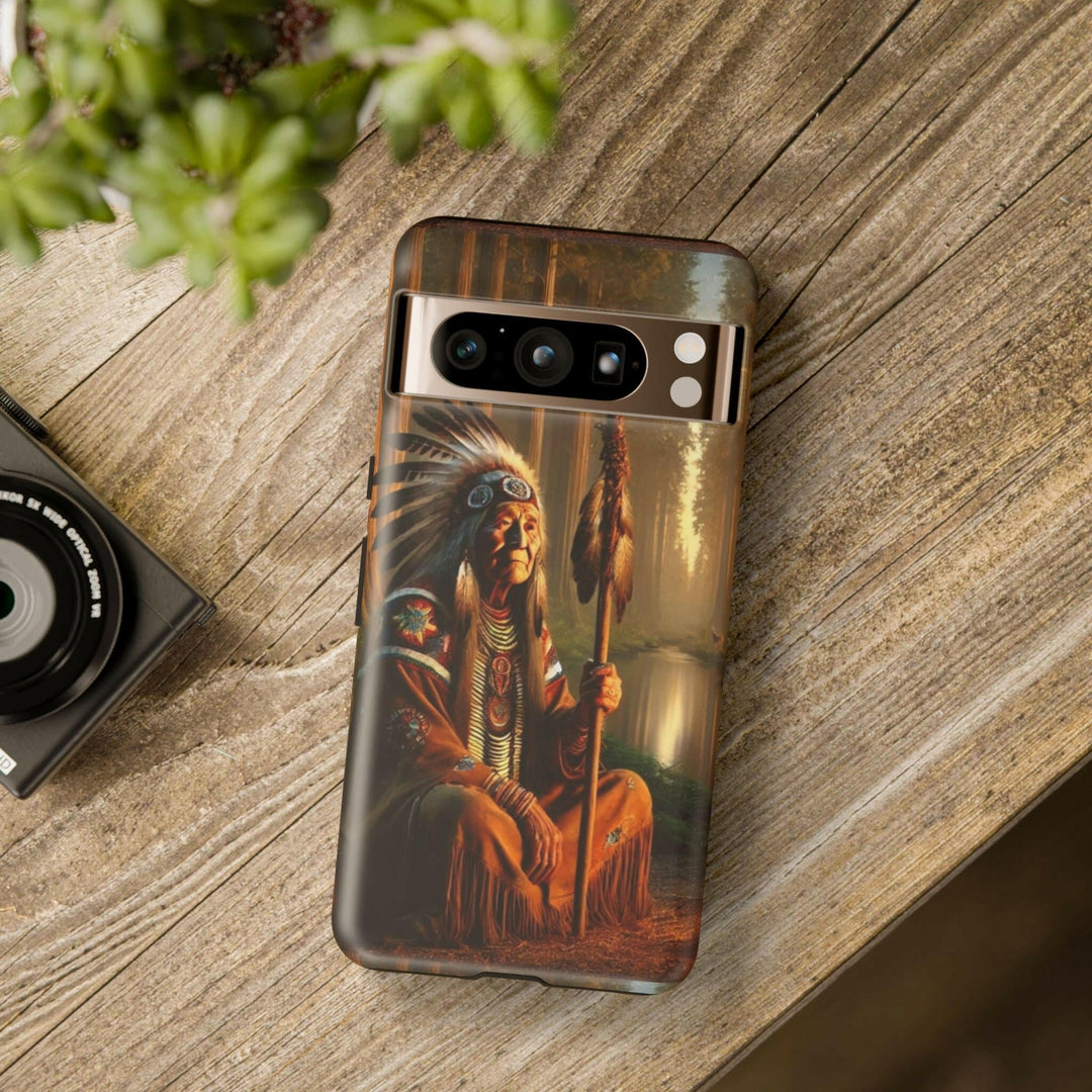 Phone case featuring a serene Native American elder holding a staff by a tranquil river. Detailed art for heritage appreciation.