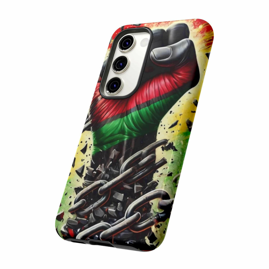 Black Pan-African fist phone case with chains breaking free, symbolizing strength and liberation. Durable and stylish for cultural expression.