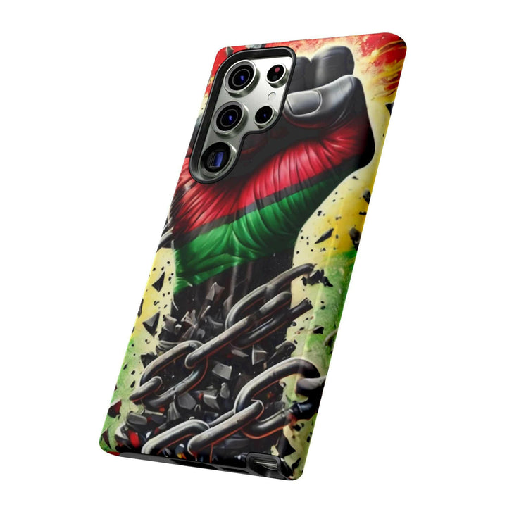 Black Pan-African fist phone case with chains breaking free, symbolizing strength and liberation. Durable and stylish for cultural expression.