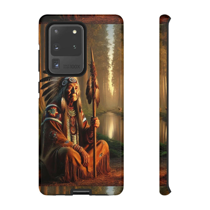 Phone case featuring a serene Native American elder holding a staff by a tranquil river. Detailed art for heritage appreciation.