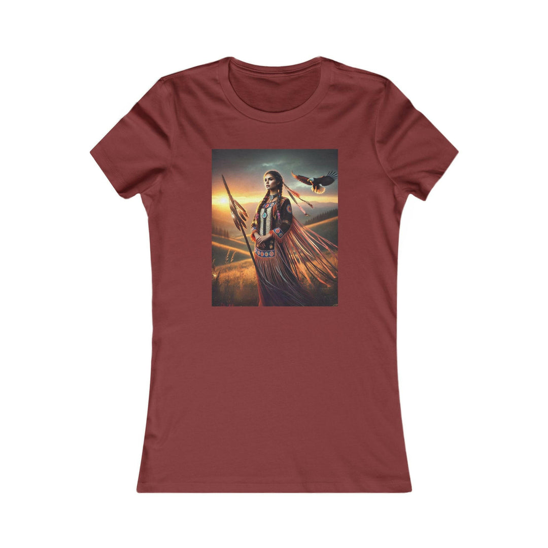 Cardinal Red T-shirt featuring an illustration of a Native American warrior woman with a spear, set against a dramatic sunset. Represents strength, heritage, and cultural pride.